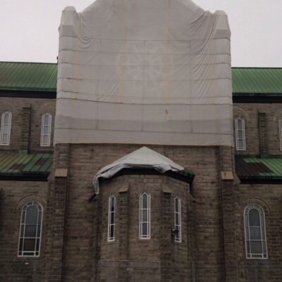 White Scafnet installed on a clock tower.